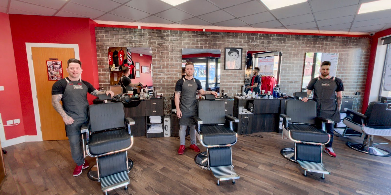 The Town Heads barber team in the shop